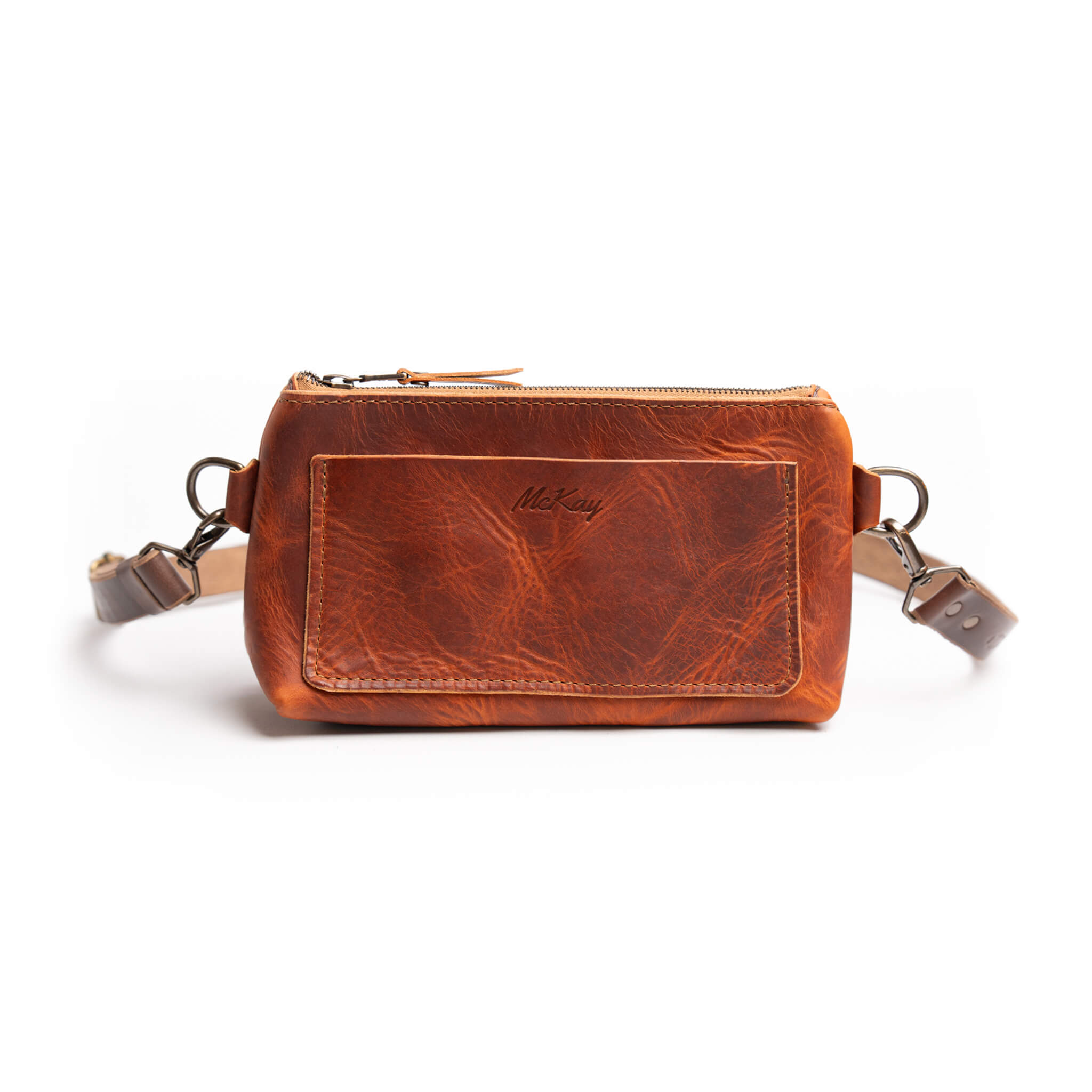 Ember red-brown Horween leather crossbody fanny pack in English Tan tones with adjustable strap and brass hardware