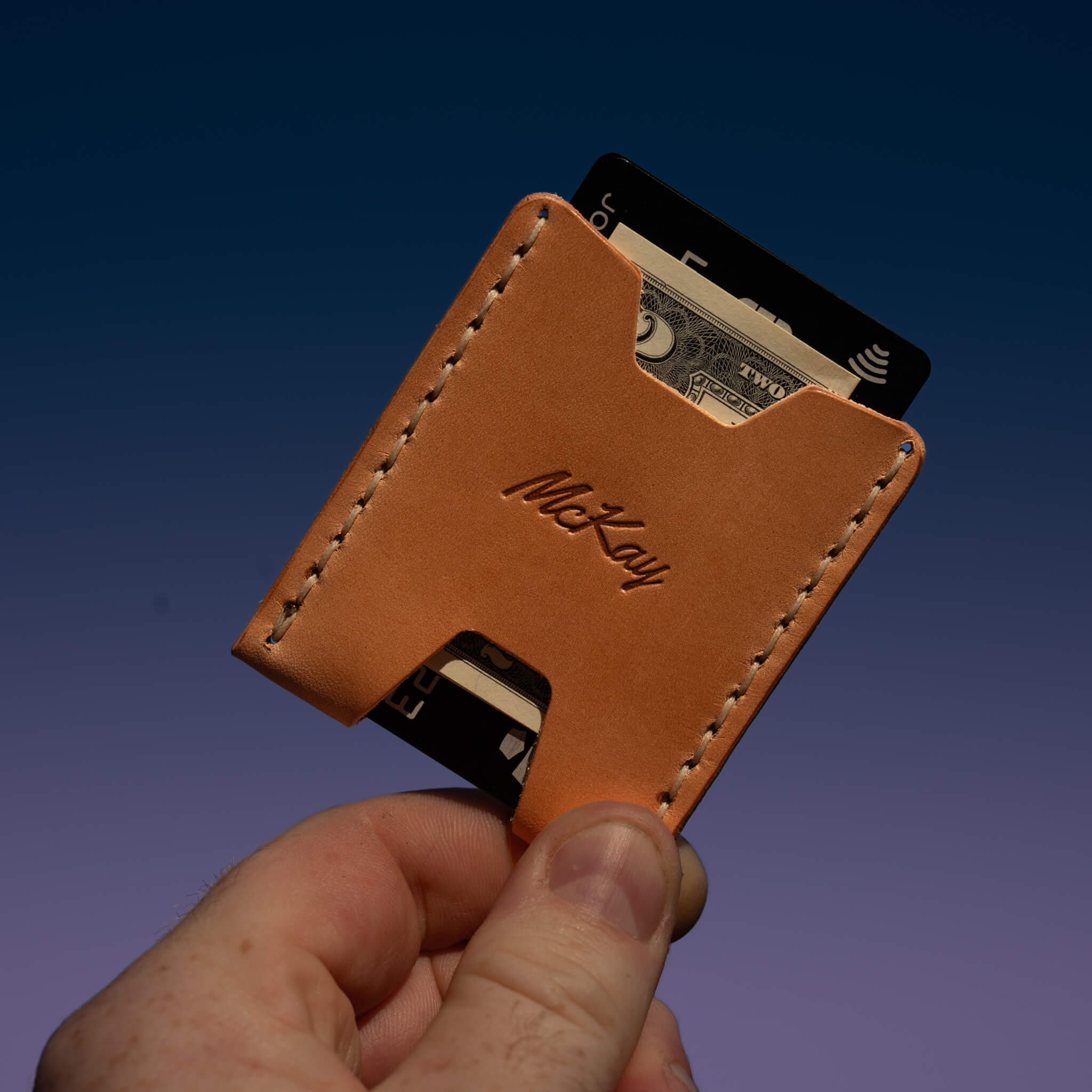 Ulysses minimalist card wallet in Canyon leather showing natural color tone and stitching.