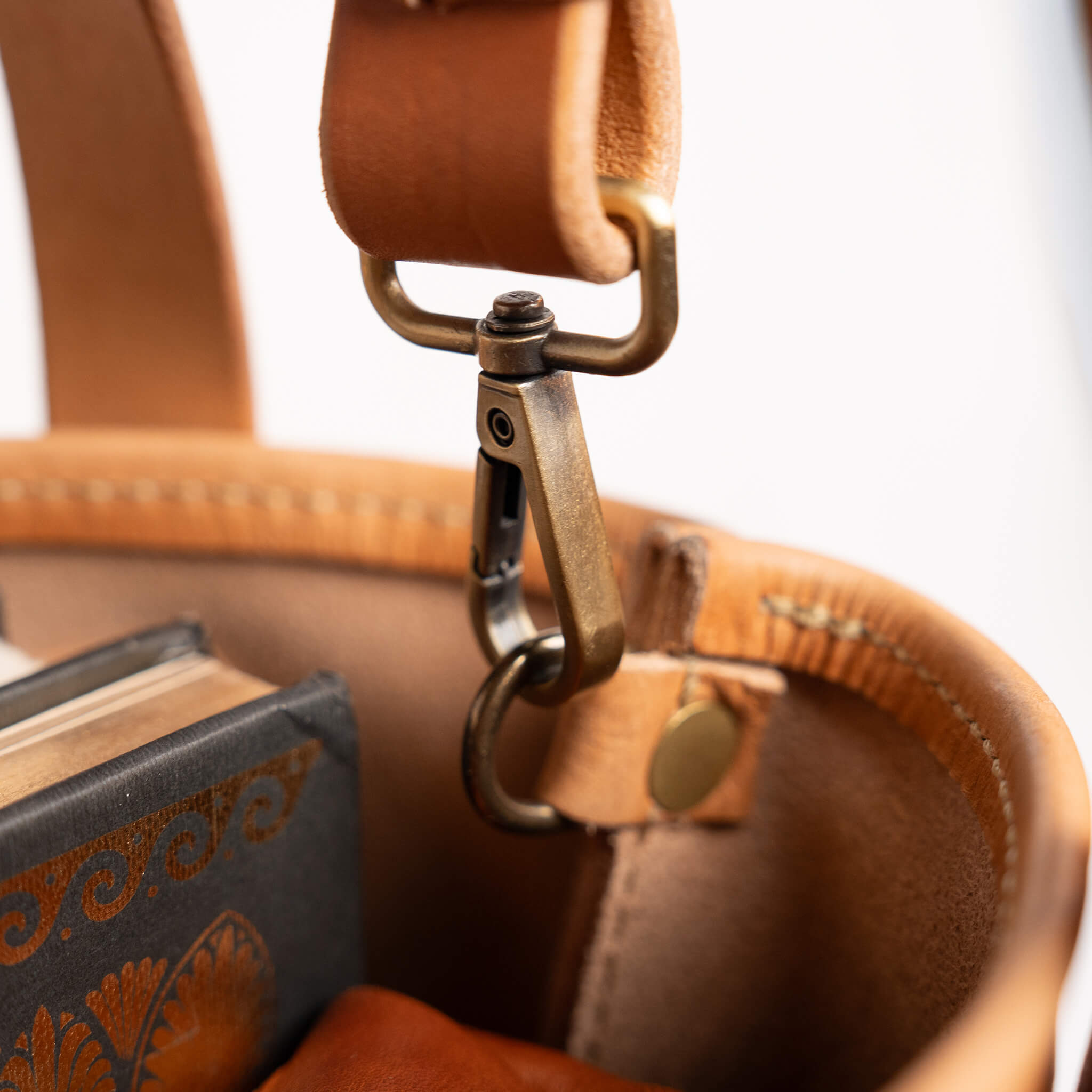 Solid brass swivel snap hardware McKay mini leather tote removable adjustable crossbody strap detail